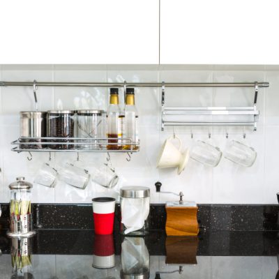 Kitchen cabinets with coffee corner in modern home living room.